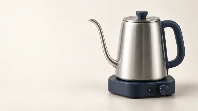 Fictional Pourpoint Kettle concept with a stainless vessel, navy handle and physical dial on its powered base.